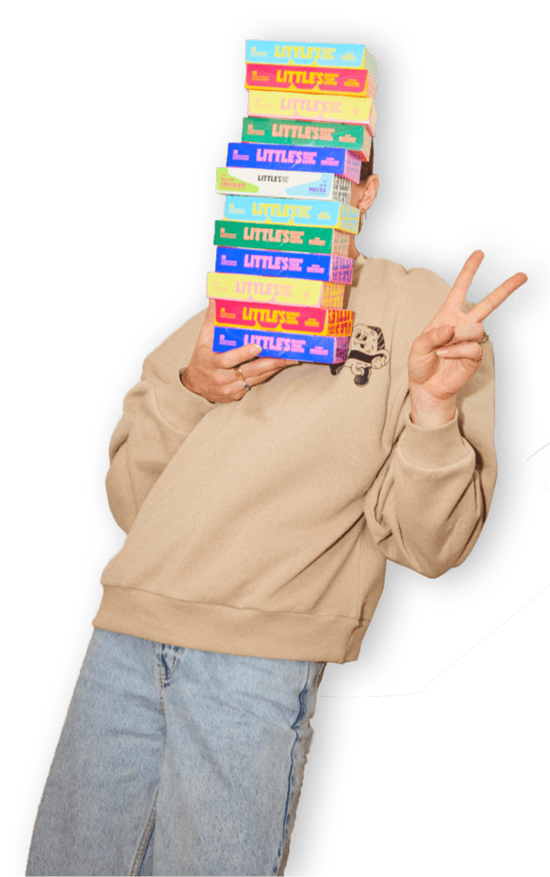 Person holding a stack of Little's coffee boxes
